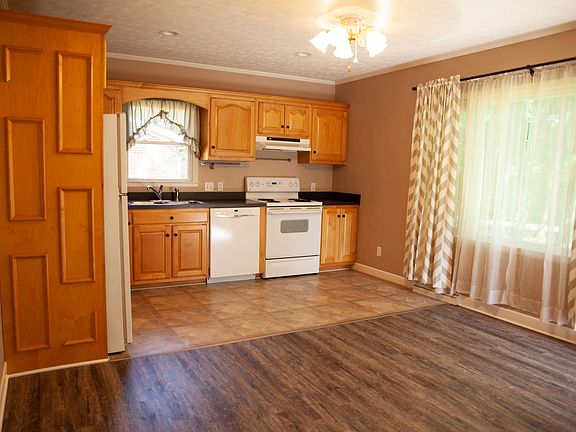 Kitchen and dining/living area just inside front entrance.