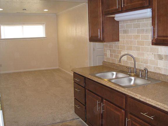 Galley kitchen and living room