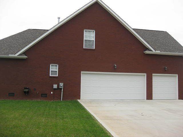 All brick/3 car garage