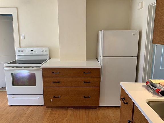Updated kitchen appliances with new cabinet and counter-top space.