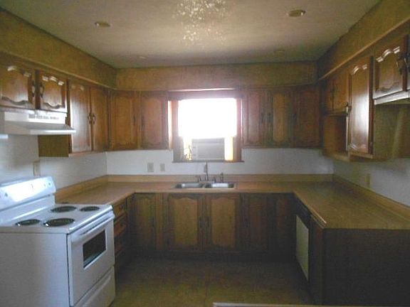 Kitchen, view 2, electric stove, range hood, dishwasher, dis