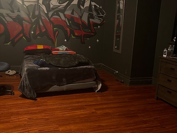 Room, freshly painted black with Mural on wall, Renner may paint if wanted