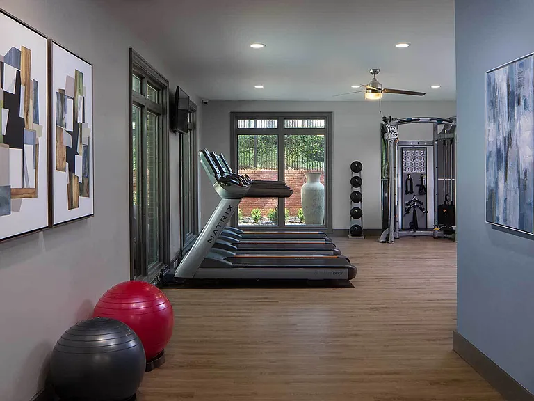 Fitness Center with Treadmills, strength training and large windows