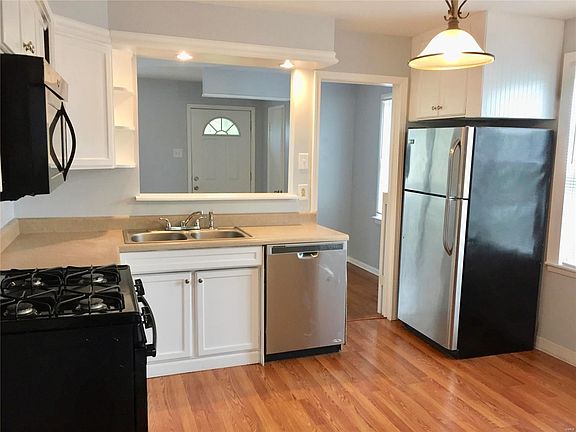 Southwest view of the kitchen towards the living room.