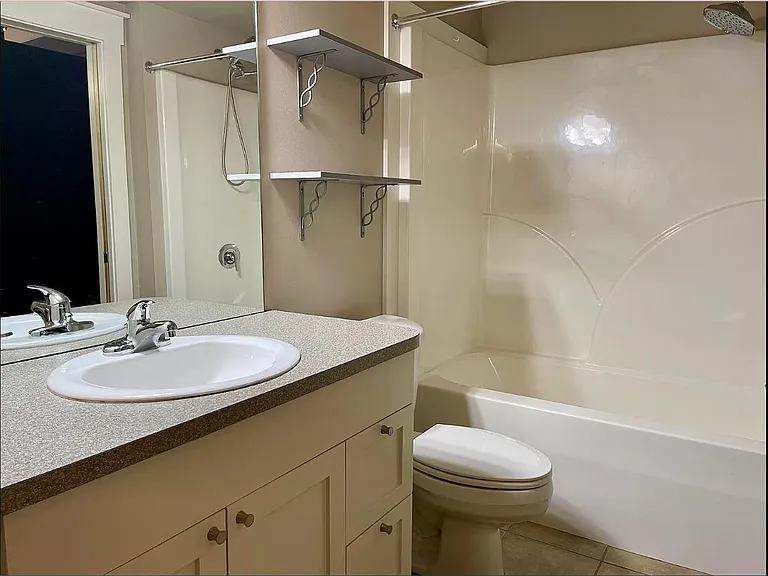Simple 1 sink, 1 bath with plenty of storage spaces.
