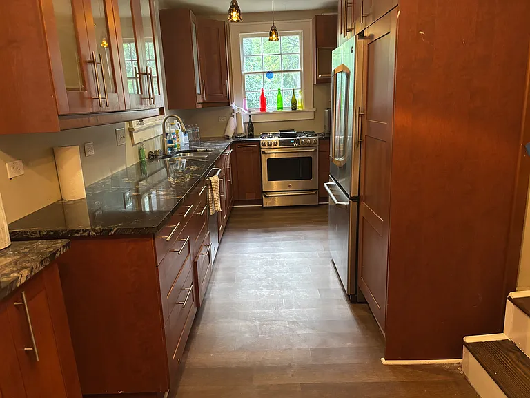 Kitchen, gas range, stainless, solid granite tops.