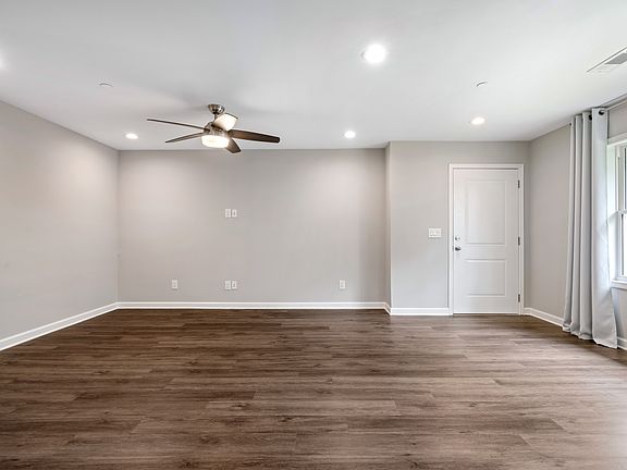 Open-floor living area with gorgeous hard surface floors