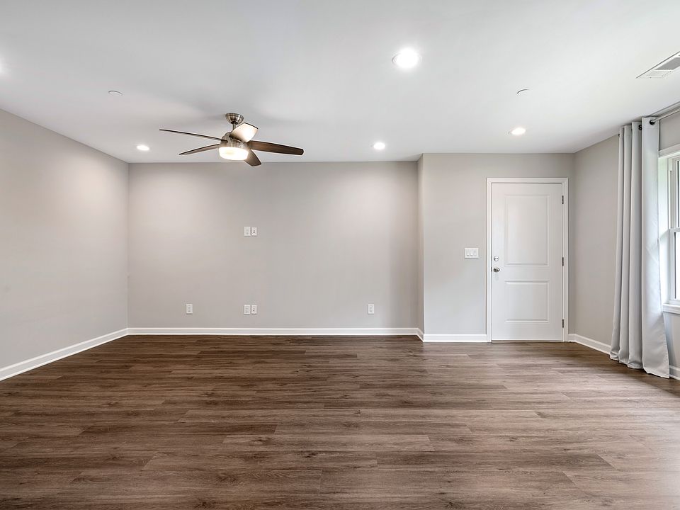 Open-floor living area with gorgeous hard surface floors