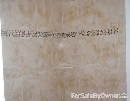 Bathroom : Shower in the new bathroom with a new tile floor.