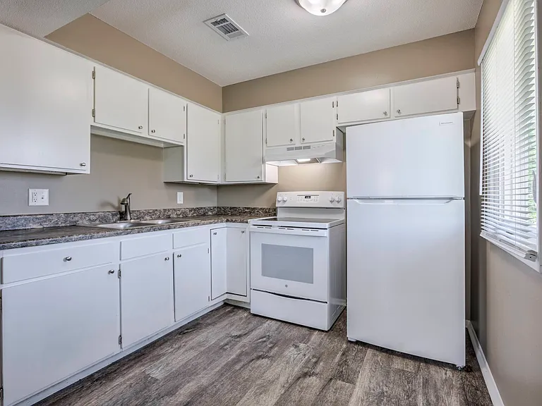 White cabinets and appliance in a kitchen.