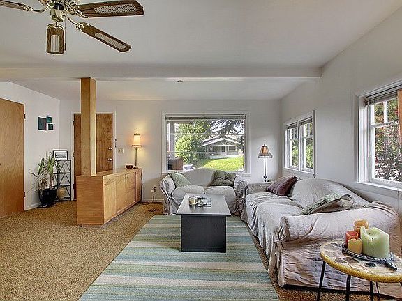 Large living room with plenty of natural light.