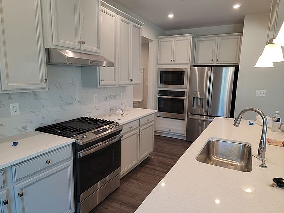 Kitchen with all stainless steel appliances.