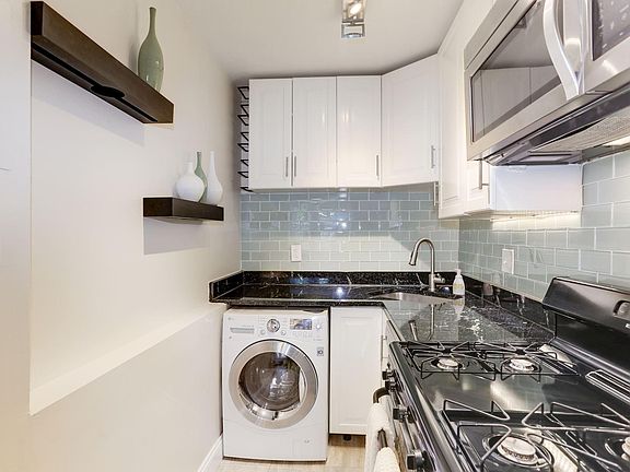 Kitchen shelves + wine racks come with unit