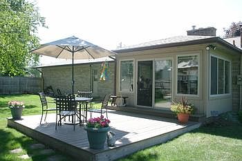 Nice deck adjacent to a great 10x14 sunroom