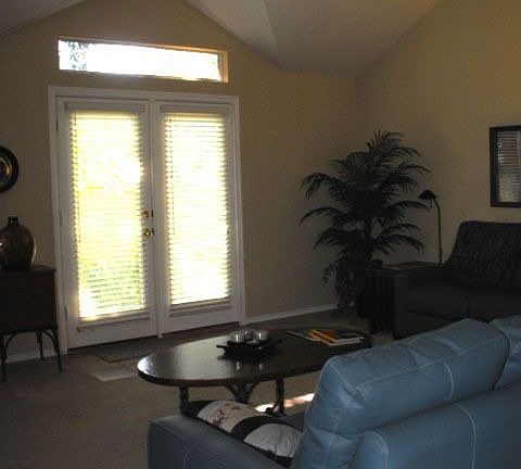 living room with French doors to backyard