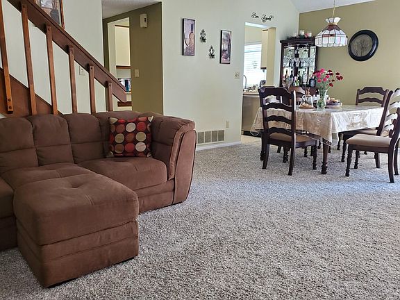 Look at that thick, fluffy carpet. Its nearly new. Dining room could accommodate even a large gathering. There's plenty of room for a china cabinet, too.