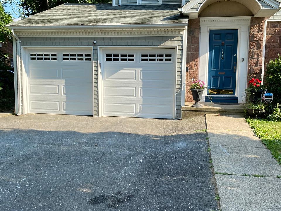 front of house with driveway - two parking spaces on right, closest to front door.