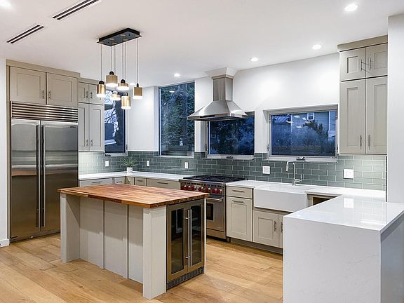 Chef's kitchen with Wolf range, Sub-Zero refrigerator, wine refrigerator, Bosch dishwasher and Samsung microwave drawer.
