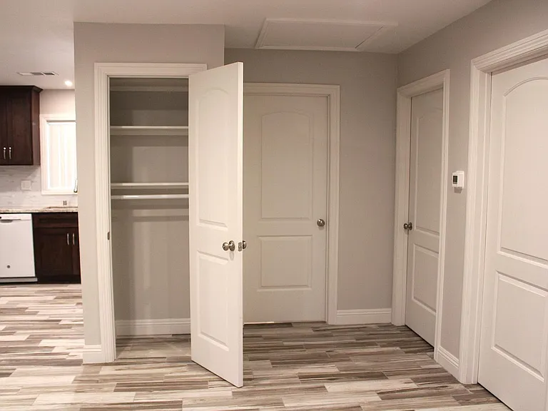 COAT/LINEN CLOSET IN LIVING ROOM