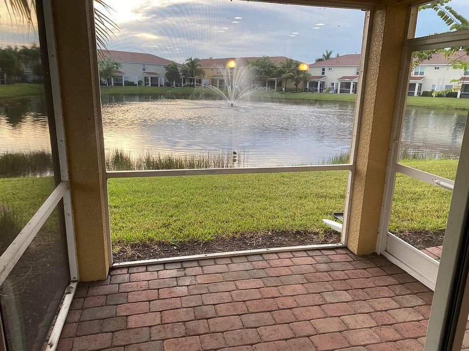 Your patio/Lanai overlooking the fountain. Lights up at night best view on the pond.