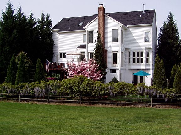 Landscaped Yard w/ Large Brick Patio and Upper Level Deck