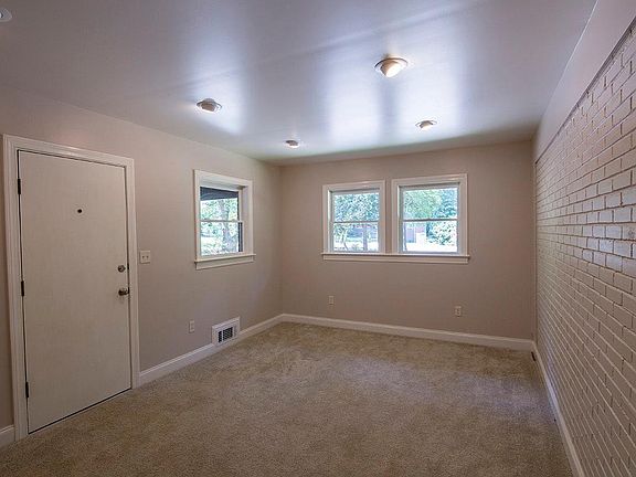 Bonus room features painted brick