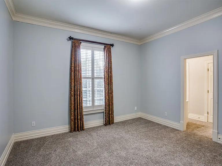 The 3rd bedroom is a nice size with a walk-in closet and a Jack-and-Jill bath. New carpet in 2025. Note: Fabric curtains have been removed.
