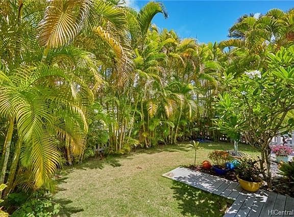 The property is completely fenced in and the tropical landscaping provides ample privacy.