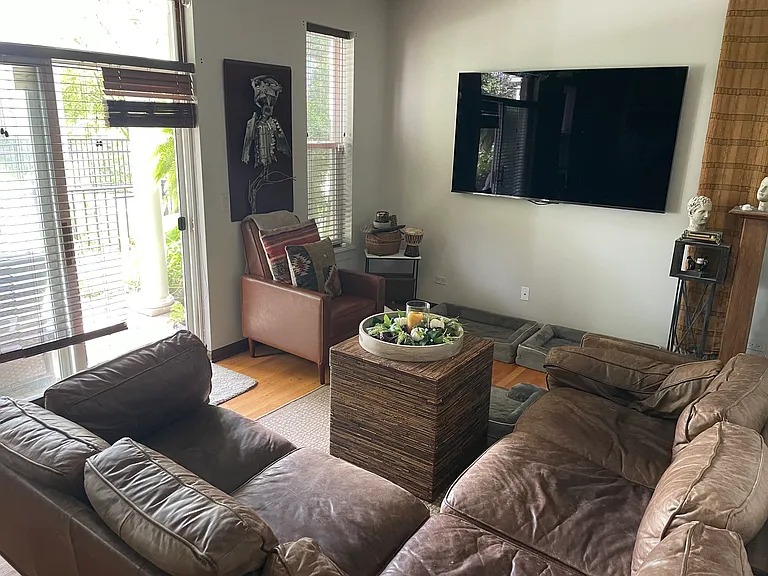 Lower level family room (4th bedroom) with giant smart tv
