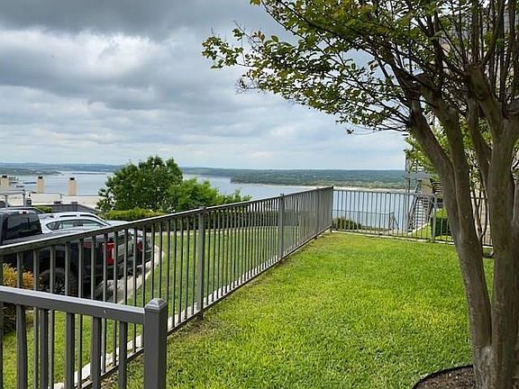 Yard area off covered patio of condo. Gorgeous Views of Lake Travis.