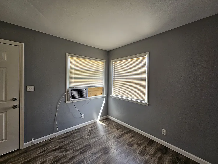 This is the living room and back door exiting to your private backyard.