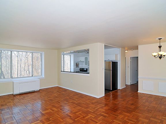 Spacious Living Room opens to Dining Room and Kitchen