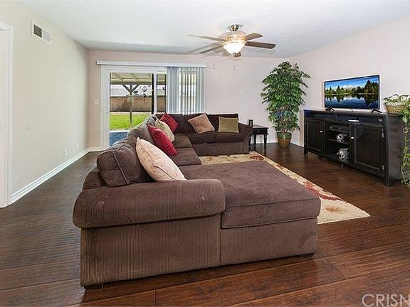 Inviting Living Room w Wood-like flooring and Feng