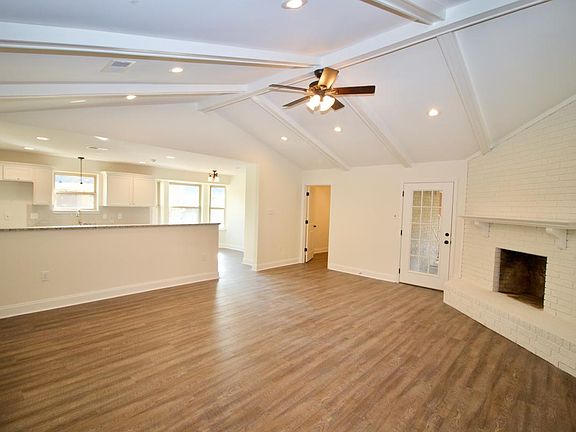 Open Design Den (The open door is the 4th bedroom) and the glass door goes out to the covered patio).