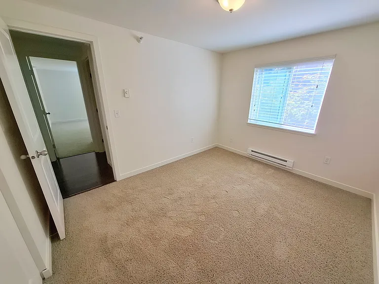 Bedroom 2: Fantastic for use as a second bedroom, office, or hobby room. Window opens to landscaped courtyard.
