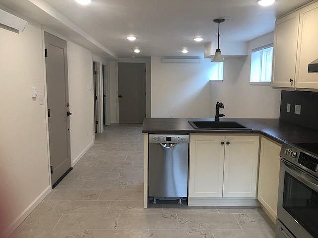 Kitchen looking toward second bedroom