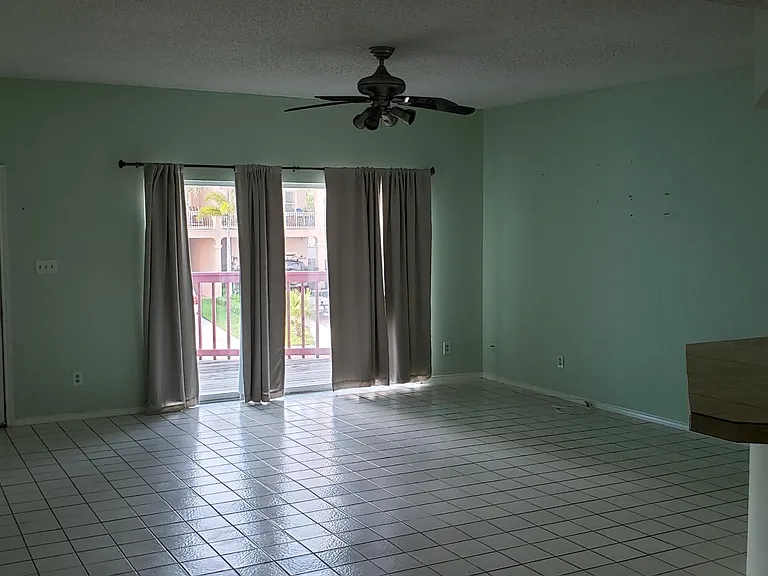 Front door on left of main living area. Looking toward the patio door.