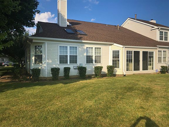 Back of condo and 3 season room.