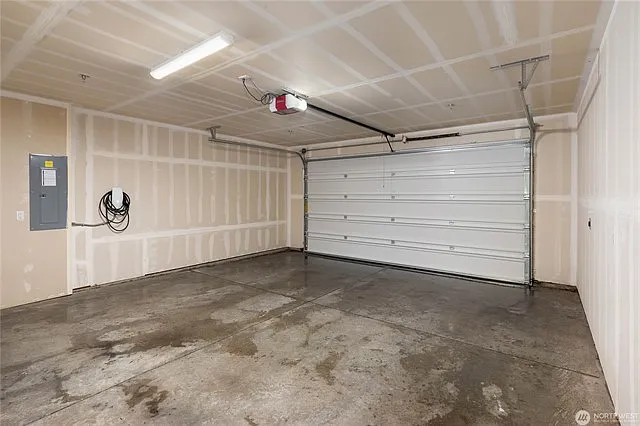 Garage interior, 2 car charging stations, 1 is Tesla ready