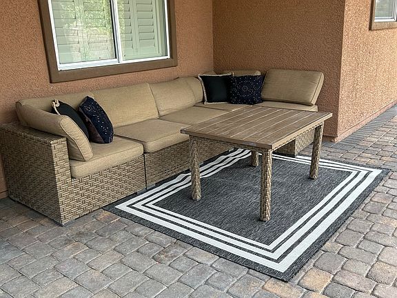 Sitting area outside by the outdoor kitchen
