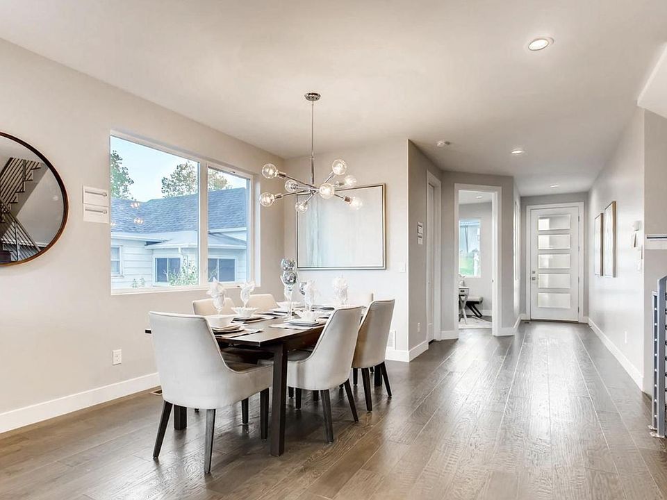 Custom, built-in shelving now surrounds the dining room window to add visual interest and function
