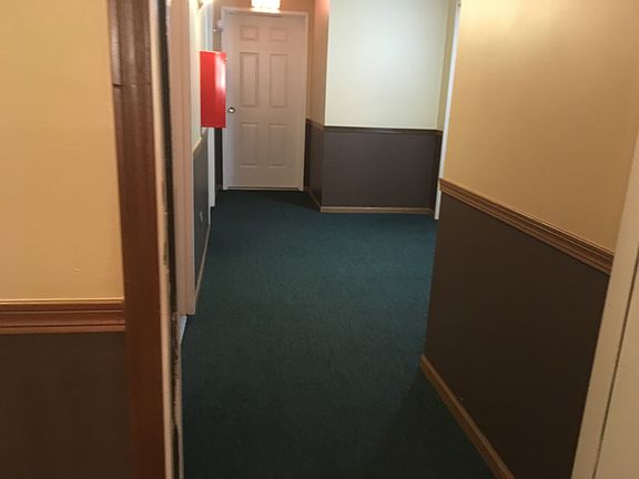 Hallway to Unit (well kept)