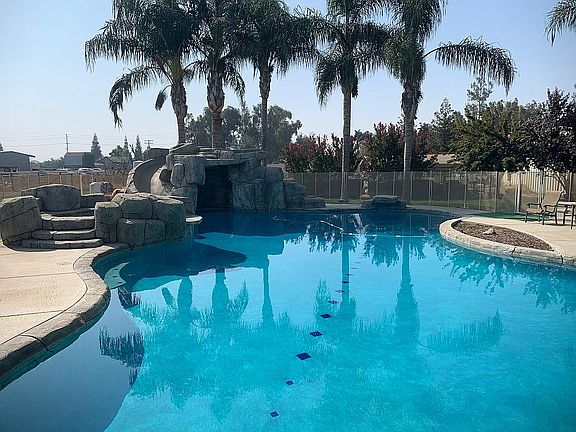 Pool area with spa and slide