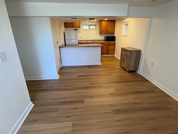 Spacious living room and open concept into the kitchen.