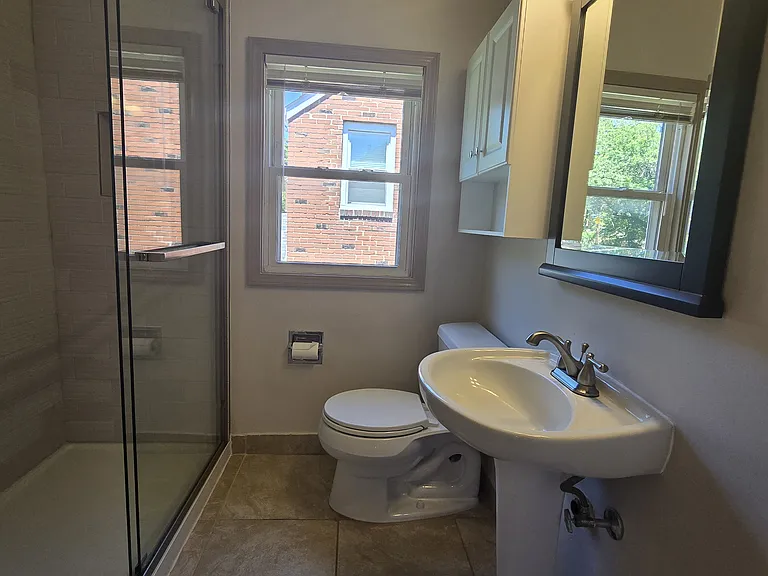 Bathroom with walk in shower.