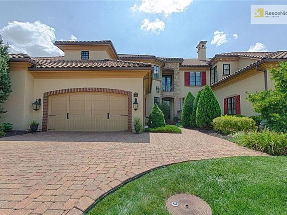 Welcome to your stunning Tuscan Condo.  Spanish style roof, 2 car garage, brick paved driveway and walkway.
