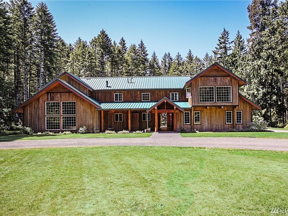 Timber-frame estate home with circular driveway beckons you to come and relax.