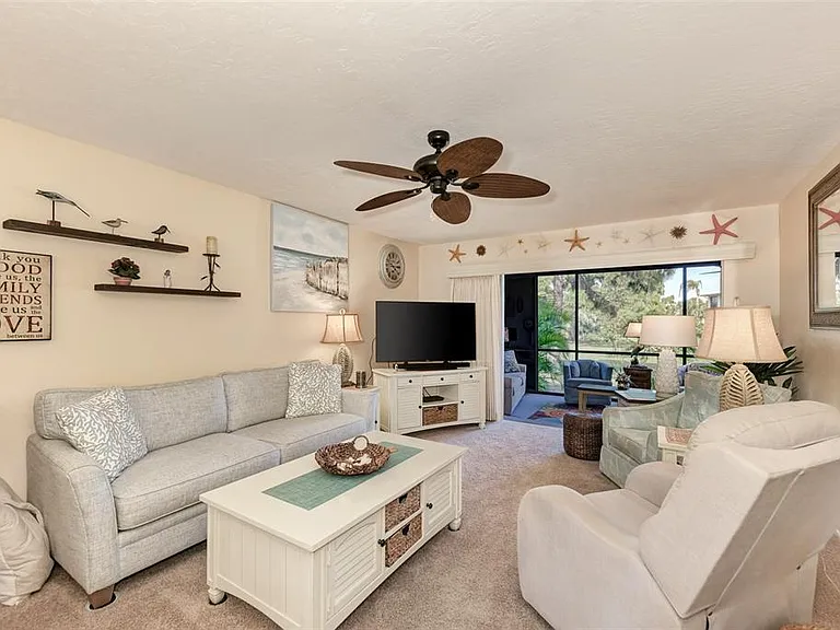 Details that make the difference. __ From the starfish decor to the way the sunlight hits the open sliders, we've made sure every corner of the living room feels bright & inviting. Open the lanai & listen to the birds from the comfort of the living room.