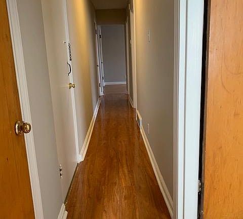 Long hall provides privacy in bedrooms away from common living space