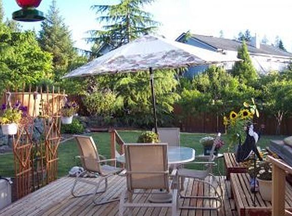 Looking out from covered deck to back yard